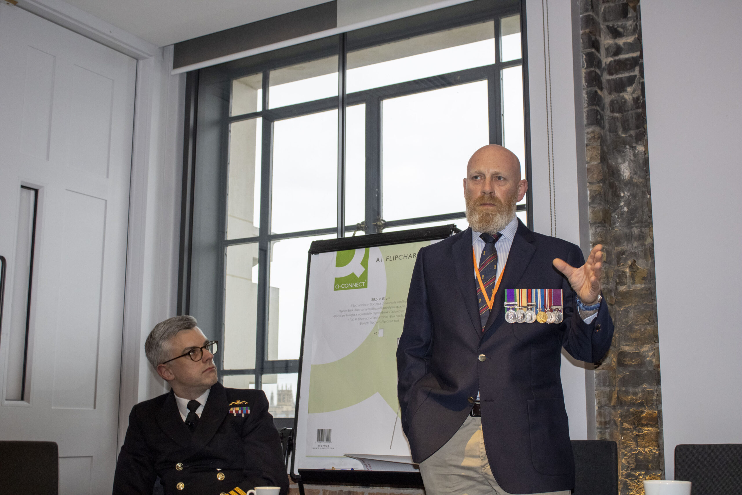 An employee of Discover explaining the Poppy Appeal Fundraiser.