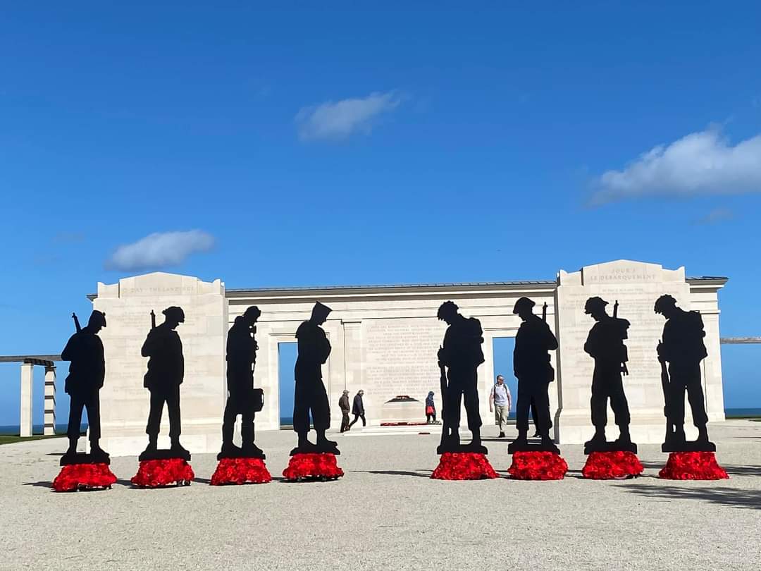 Silhouettes of soldiers on Normandy Beach