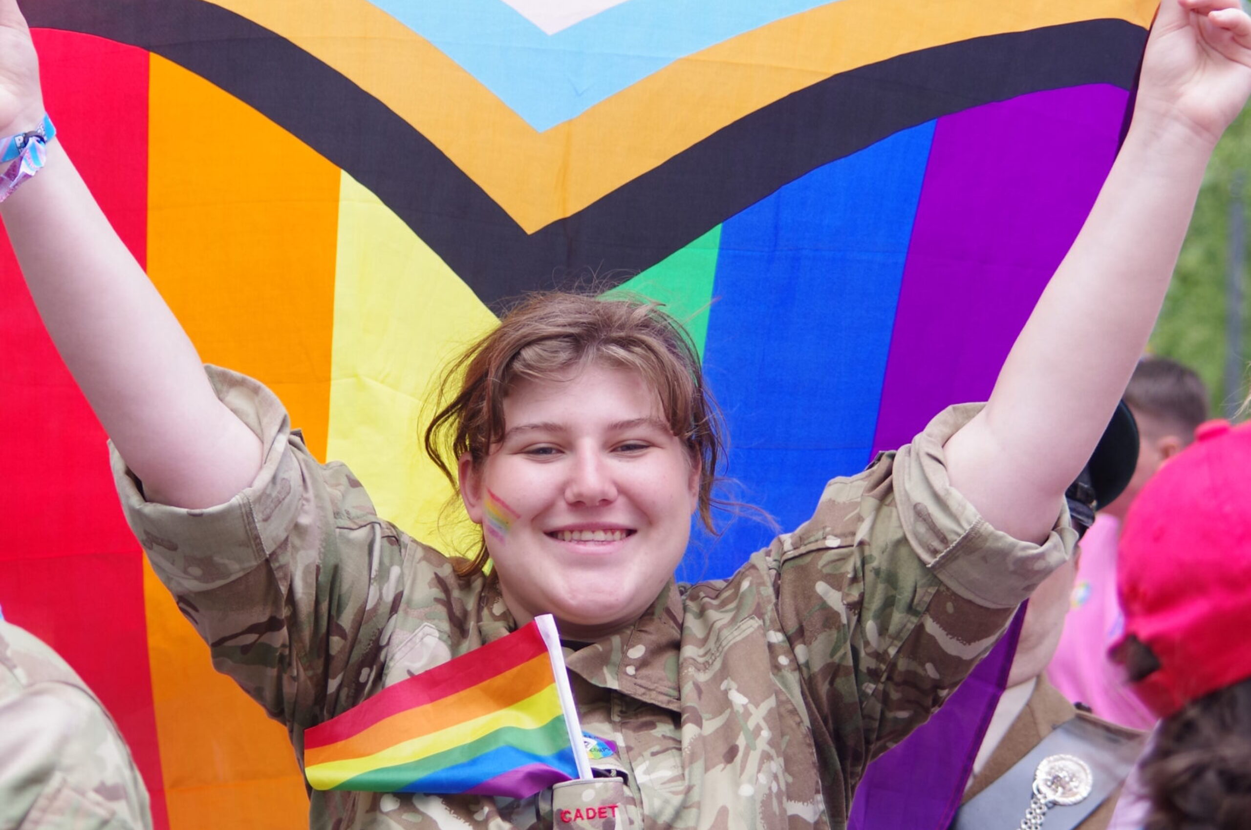 A cadet holding the pride flag during the London Pride Parade 2023