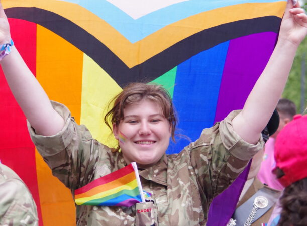 A cadet holding the pride flag during the London Pride Parade 2023